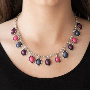Silver frames, round and oval multicolored beads swing from silver chain